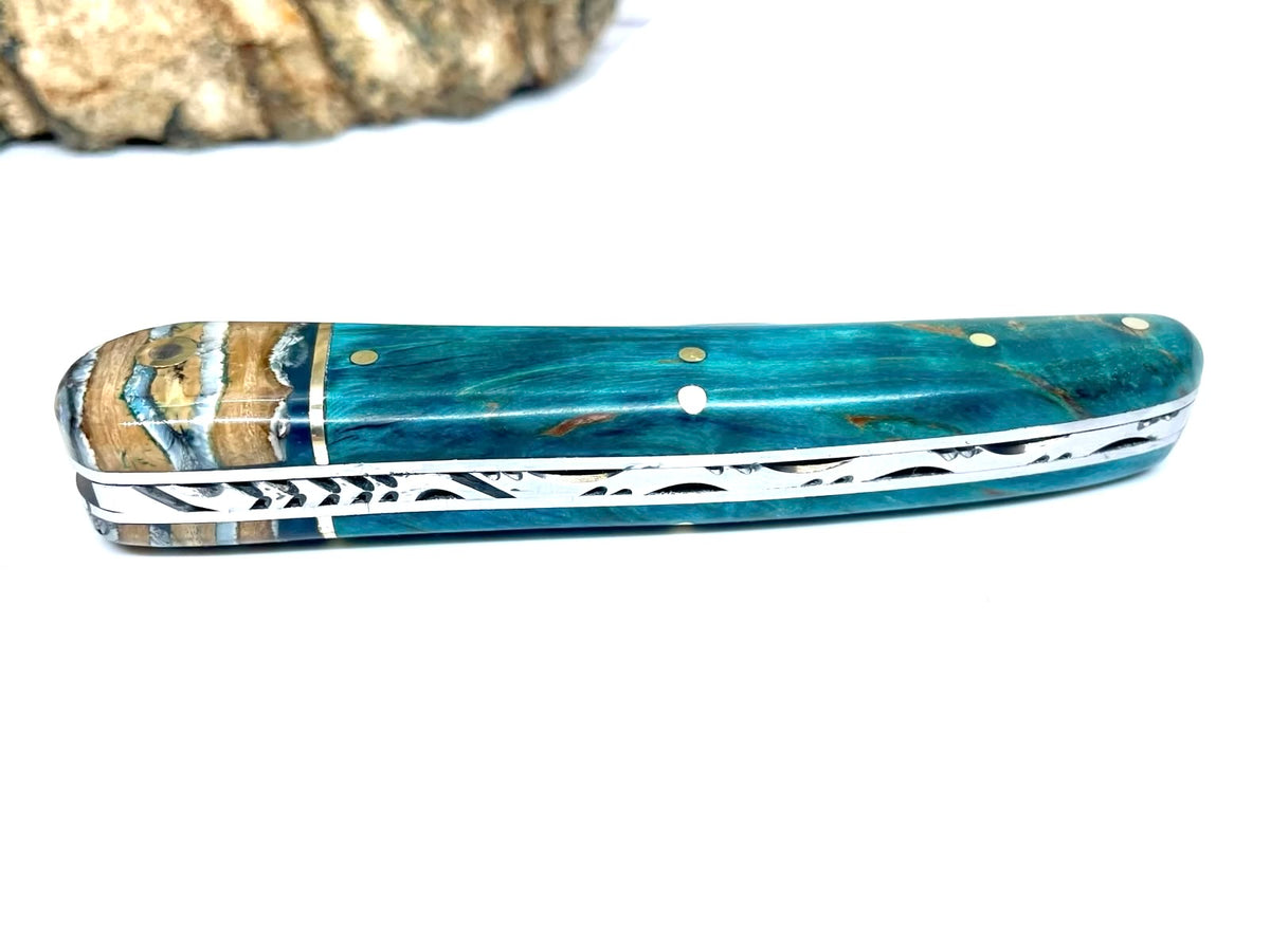 Coutellerie Passarelli - Couteau Alsacien lame pliable 10 cm mitre en molaire de mammouth, Bouleau madré teinté (turquoise) et stabilisé