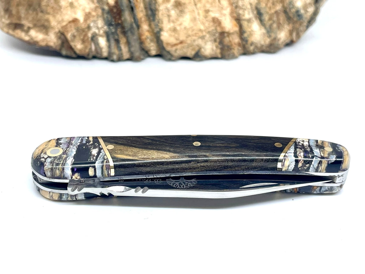Coutellerie Passarelli - Couteau Alsacien lame pliable 10 cm mitres en molaire de mammouth, Ébène royale du Laos