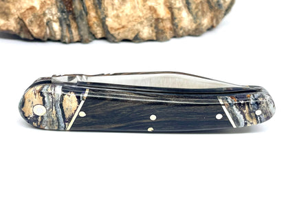 Coutellerie Passarelli - Couteau Alsacien lame pliable 10 cm mitres en molaire de mammouth, Ébène royale du Laos