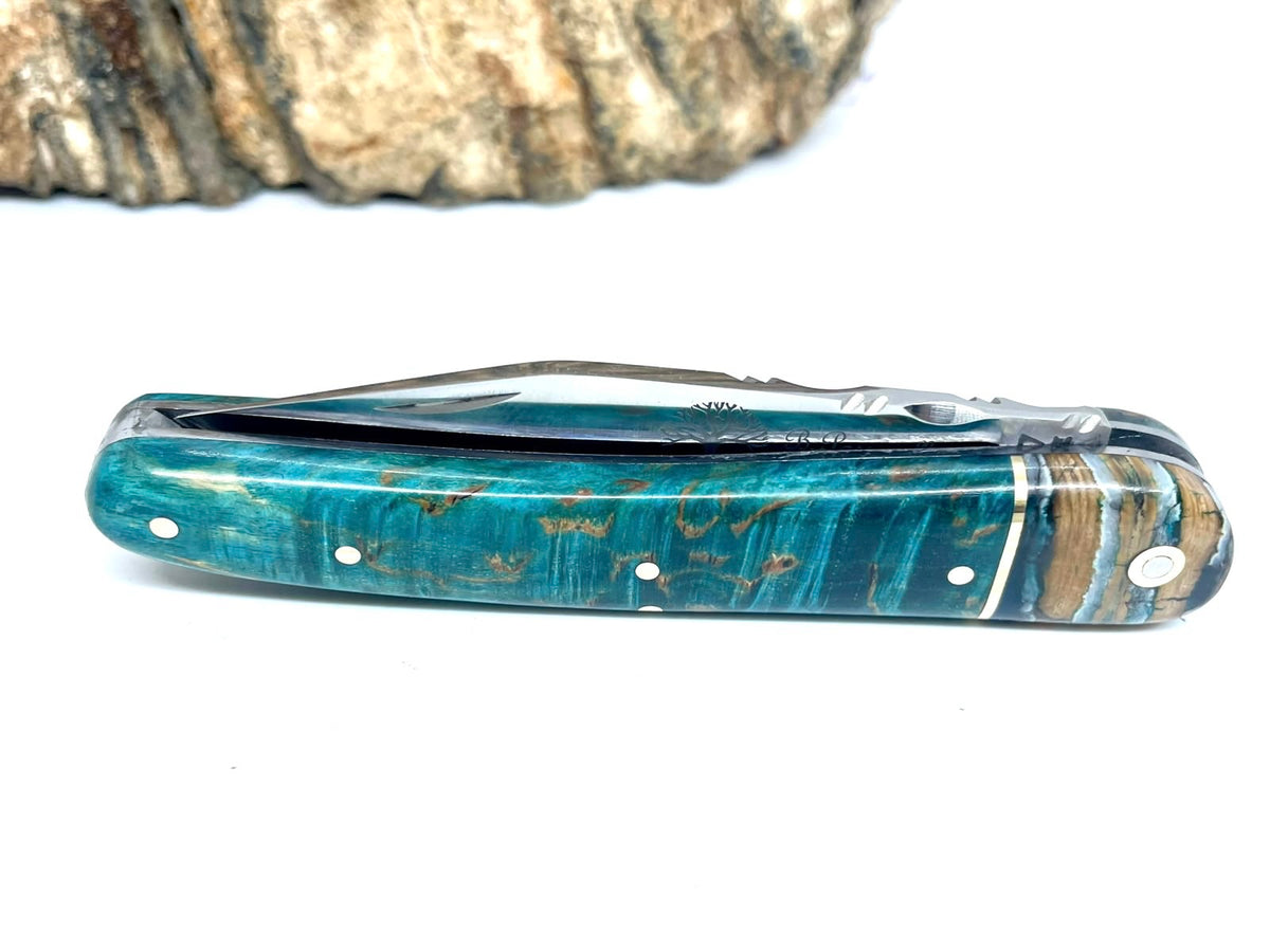 Coutellerie Passarelli - Couteau Alsacien lame pliable 10 cm mitre en molaire de mammouth, Bouleau madré teinté (turquoise) et stabilisé