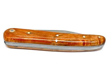 Coutellerie Passarelli - Couteau Alsacien lame pliable 10 cm Bouleau madré teinté et stabilisé orange
